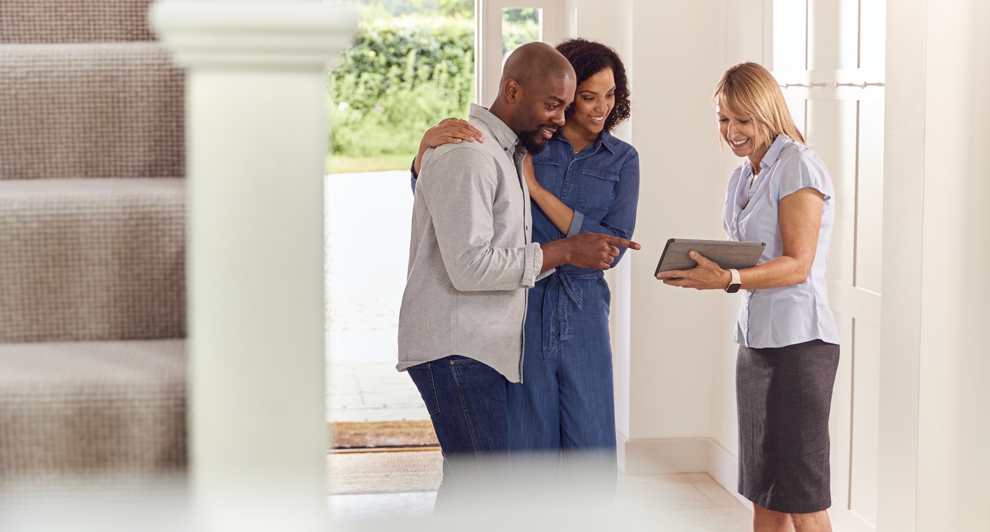 Couple Viewing Potential New Home With Female Realtor